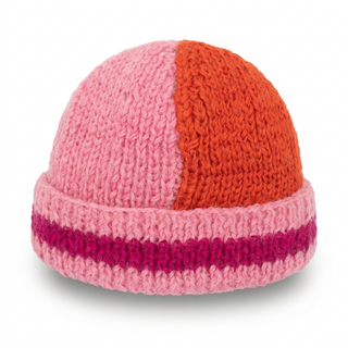 Knitted hat with pink and orange color block design on a white background
